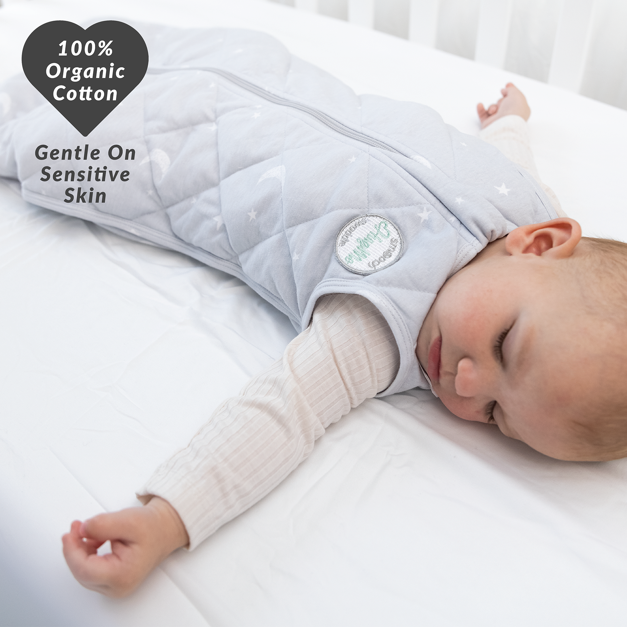 baby wrapped in weighted sleep sack