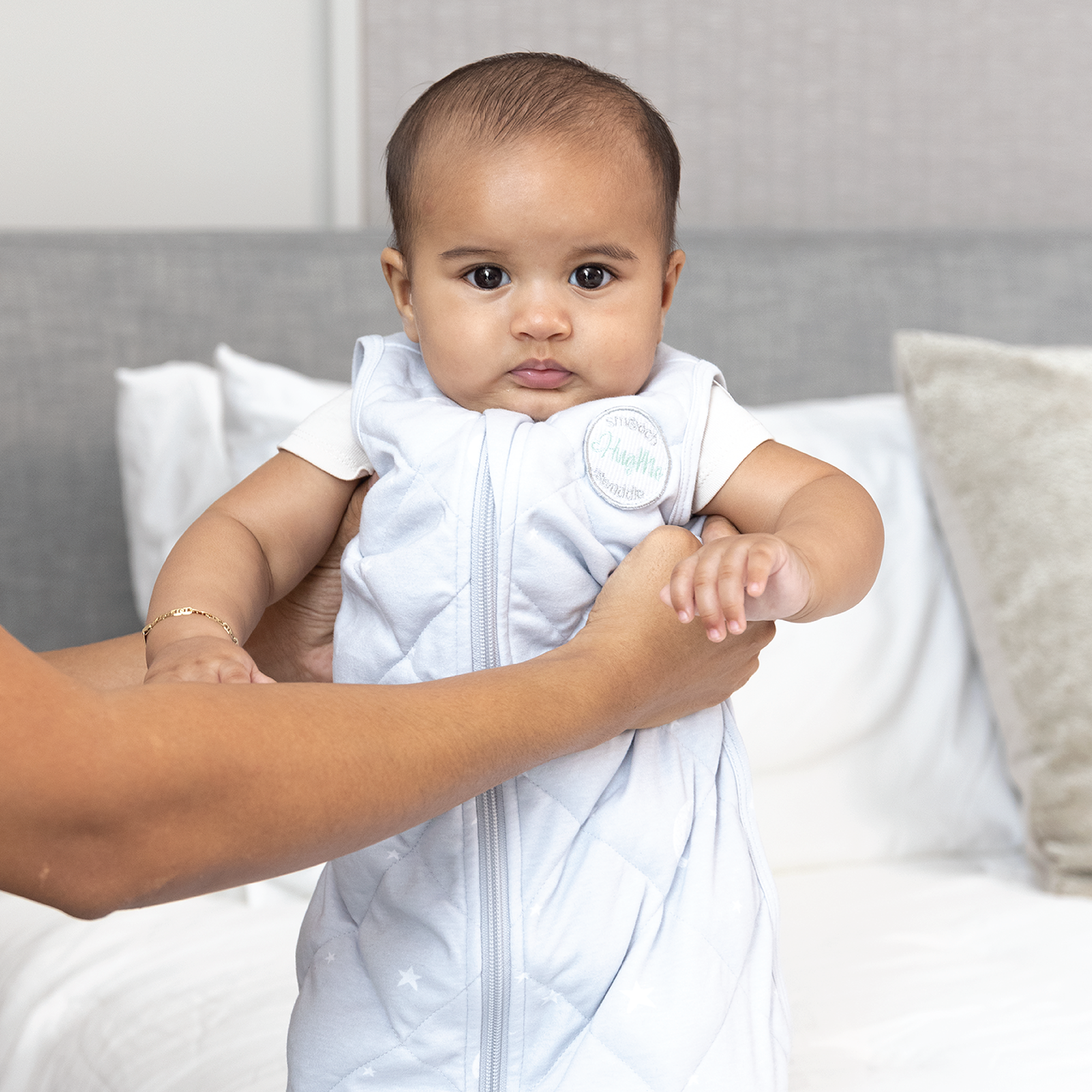 baby wrapped in weighted sleep sack