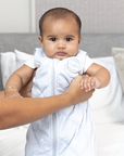 baby wrapped in weighted sleep sack