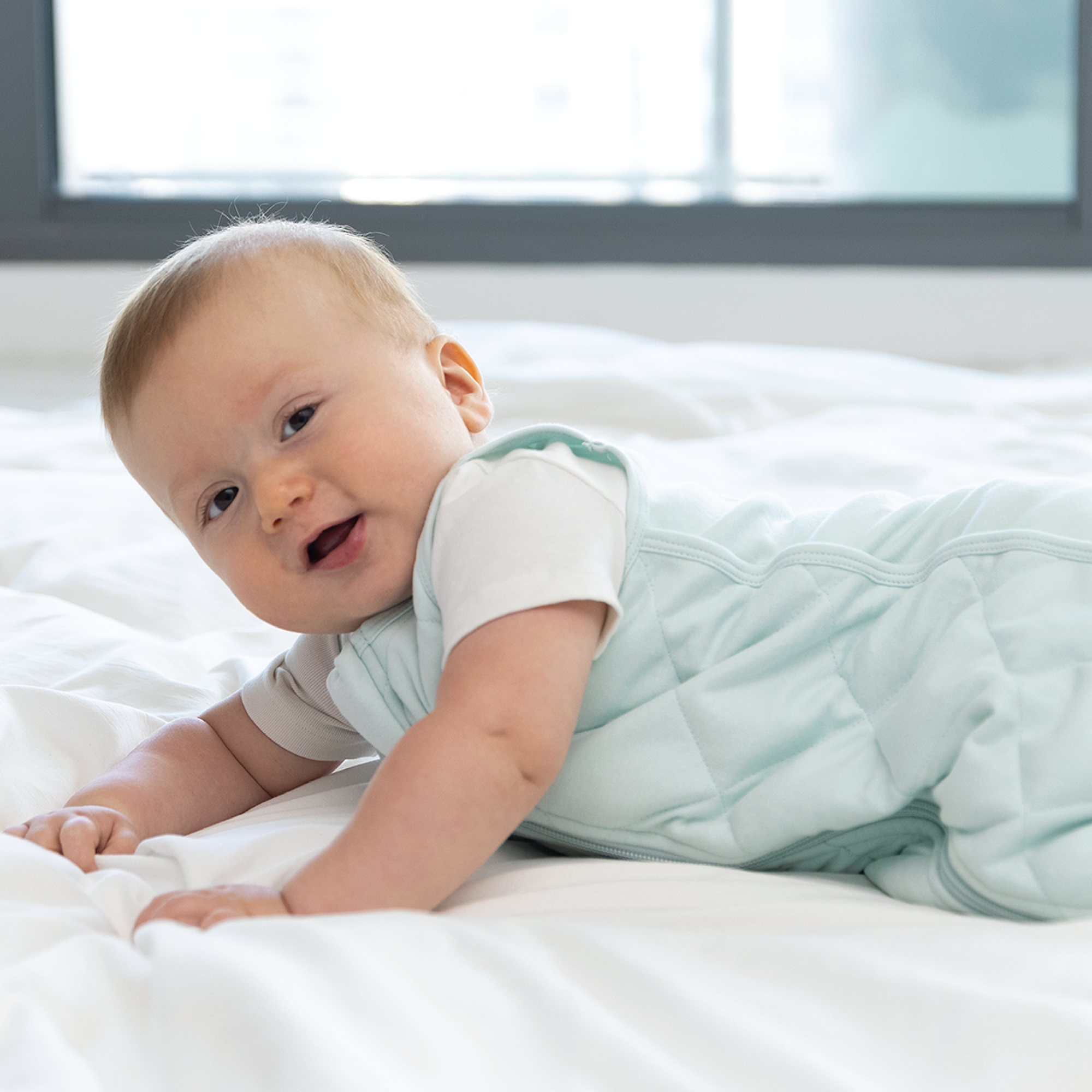 baby in weighted sleep sack
